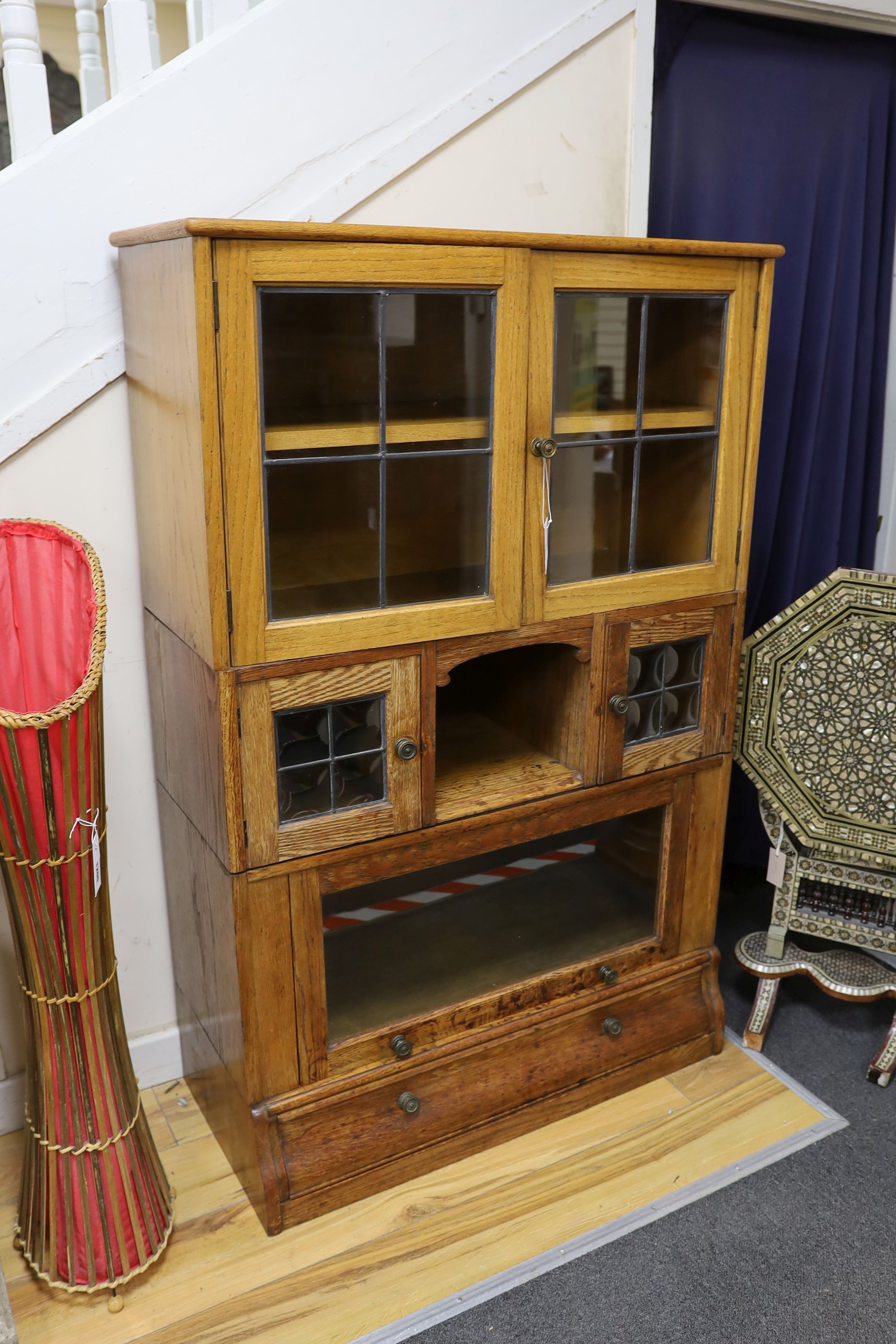 An early 20th century oak Globe Wernicke style four section oak bookcase, length 88cm, depth 36cm, height 136cm